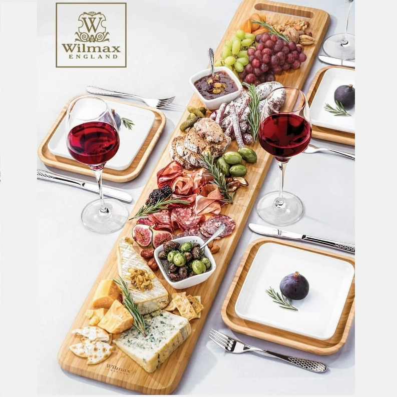 Large feast Charcuterie plating set including long bamboo serving tray and square bamboo platters with fine porcelain plates to match